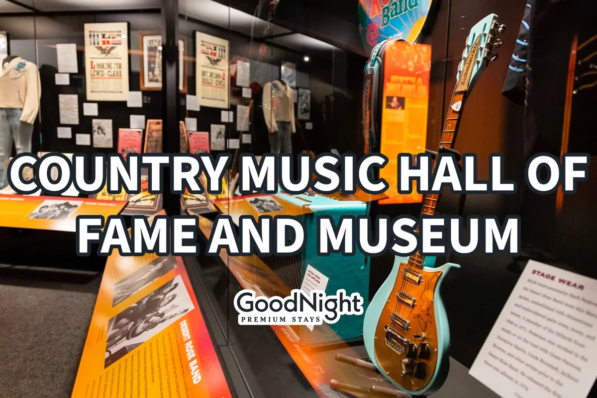 A vibrant interior scene from a Nashville music museum, featuring guitars, stage wear, and iconic memorabilia. The display celebrates the city's rich musical heritage and legendary country music artists.